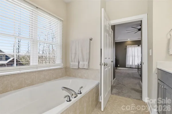 a bathroom with a tub and a shower