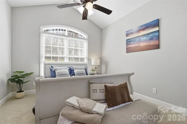 a work room with furniture and a window