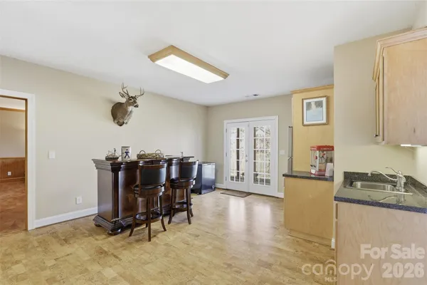 a view of a livingroom with furniture and lounge chair