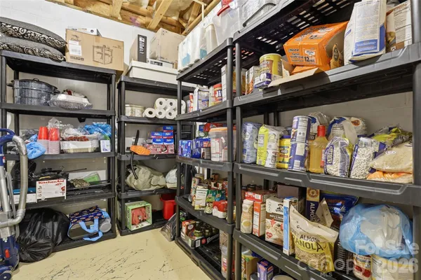 a front view of a house with a yard and large trees