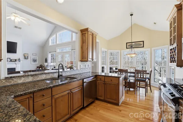 a kitchen with lots of counter top space and dining table