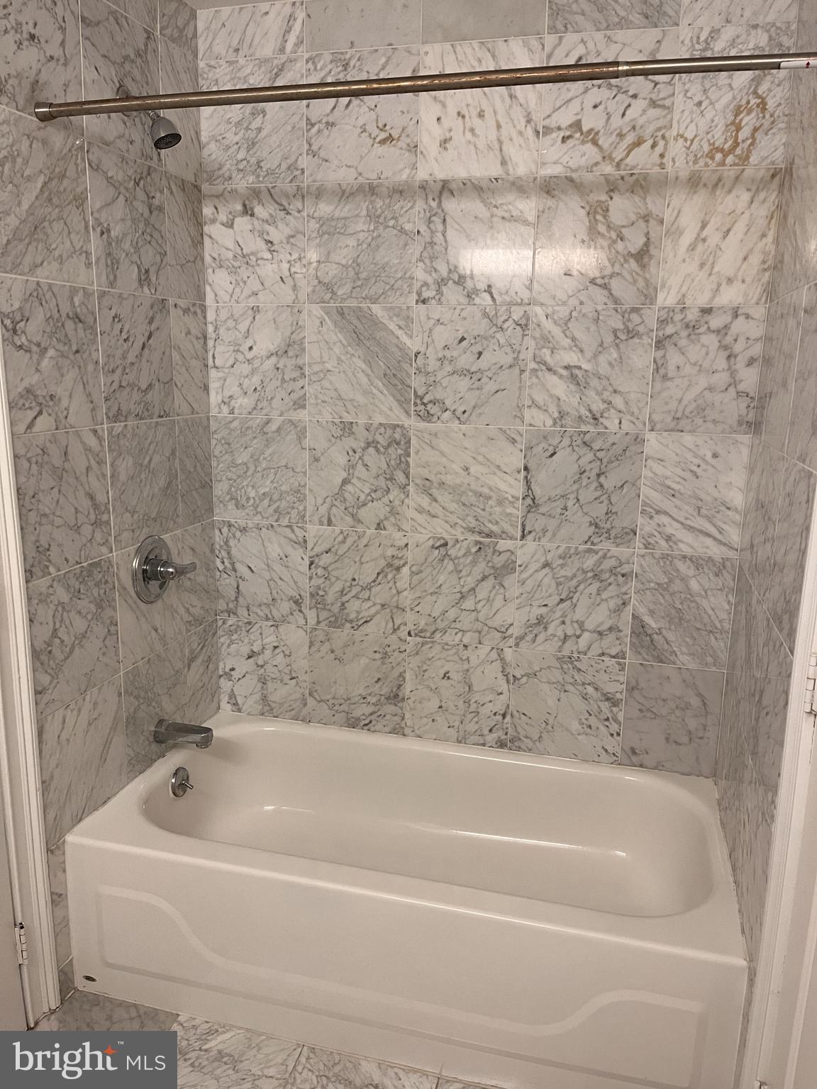 1500 Chestnut Street, Unit 15I Philadelphia, PA 19102 - Photo 14 of 18 a bathroom with a shower and a bath tub