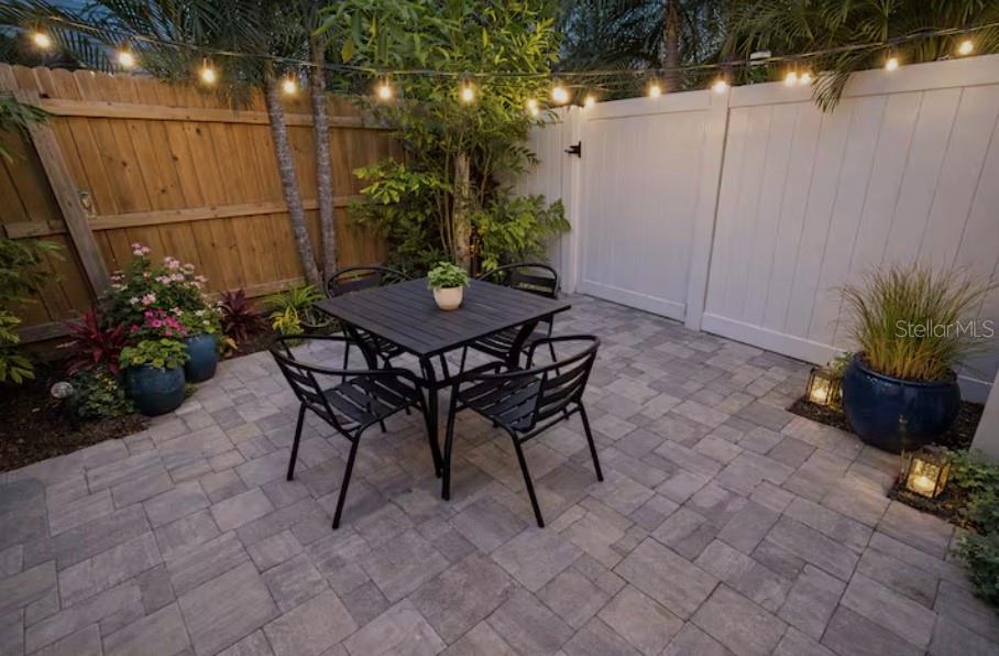 1214 Bay Pine Boulevard Indian Rocks Beach, FL 33785 - Photo 22 of 49 a view of a backyard with furniture and a potted plants