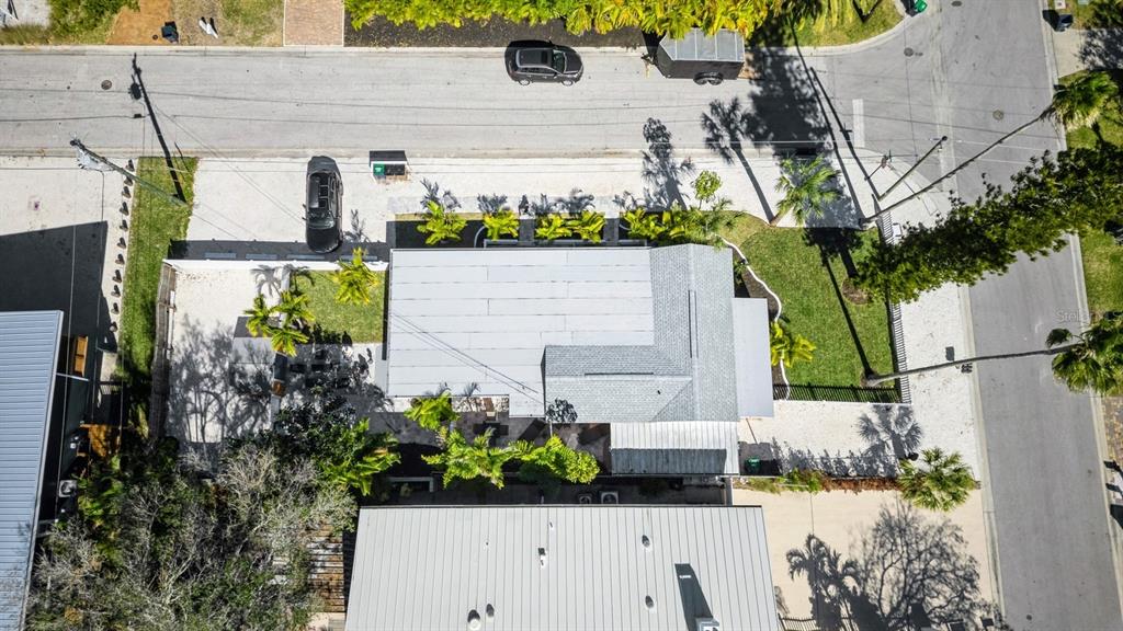 1214 Bay Pine Boulevard Indian Rocks Beach, FL 33785 - Photo 44 of 49 an aerial view of a house with a yard and garden
