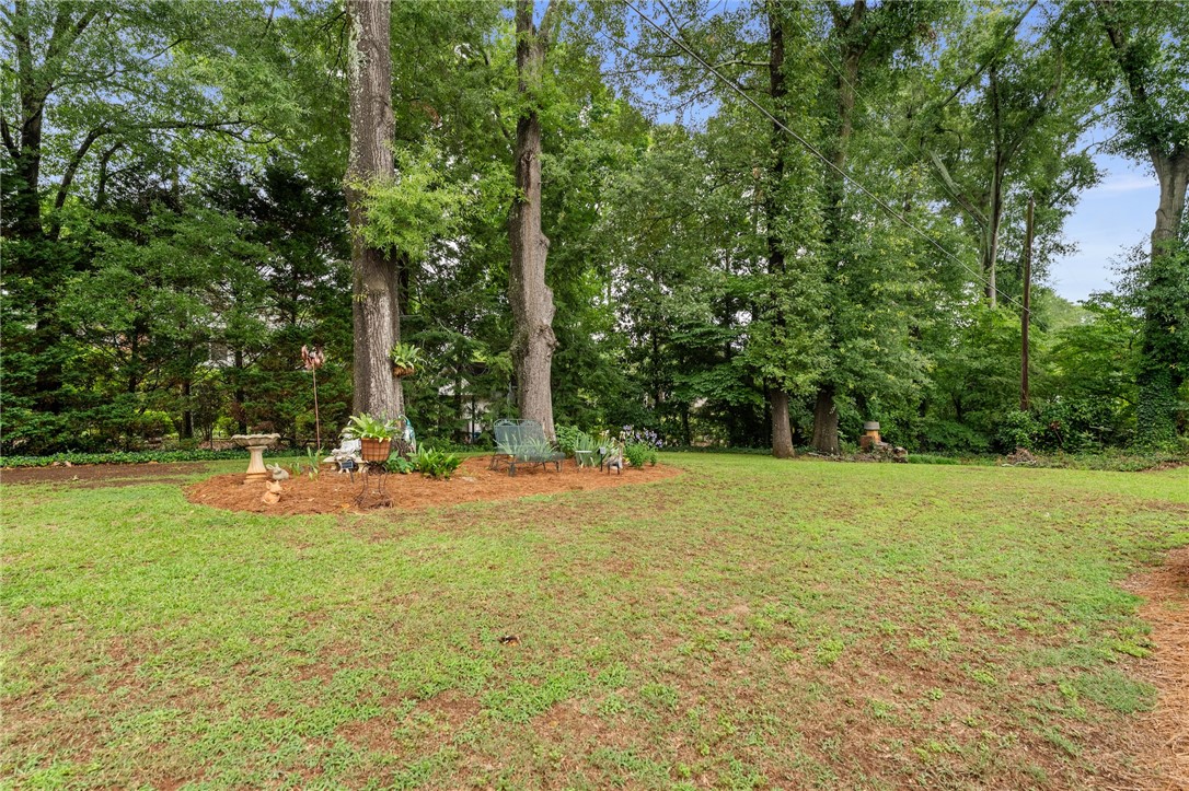 1105 Greenacres Anderson, SC 29621 - Photo 41 of 46 A verdant backyard retreat offering ample space for outdoor enjoyment and relaxation.
