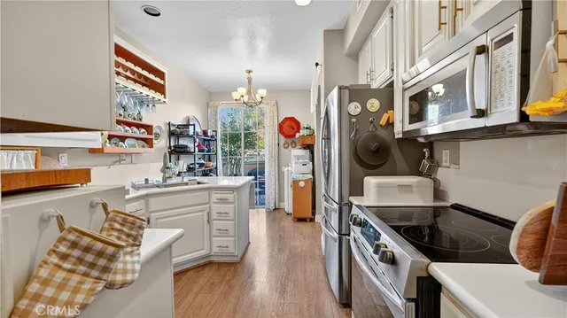 a kitchen with stainless steel appliances granite countertop a stove and a sink