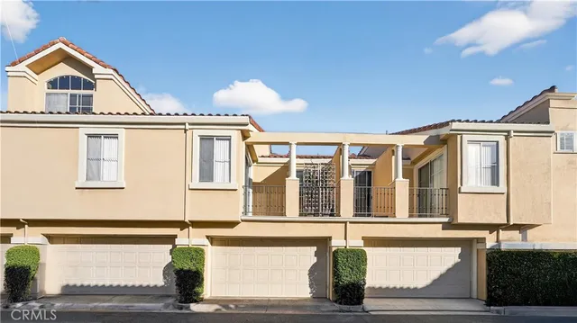 a front view of a house with large windows
