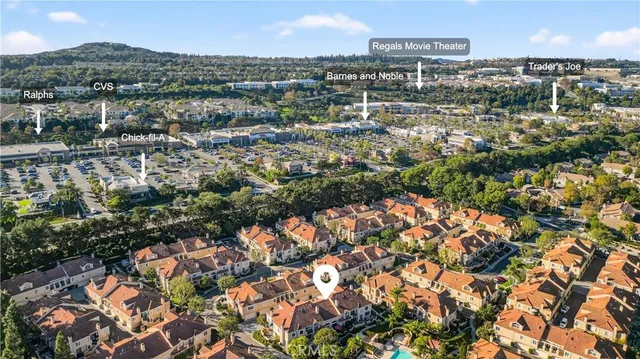 an aerial view of residential houses with outdoor space