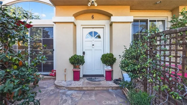 a view of house with outdoor space and trees