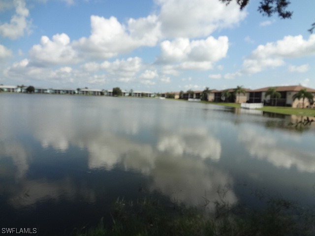 25225 Rampart Boulevard Punta Gorda, FL 33983 - Photo 3 of 7 a view of a lake from a yard