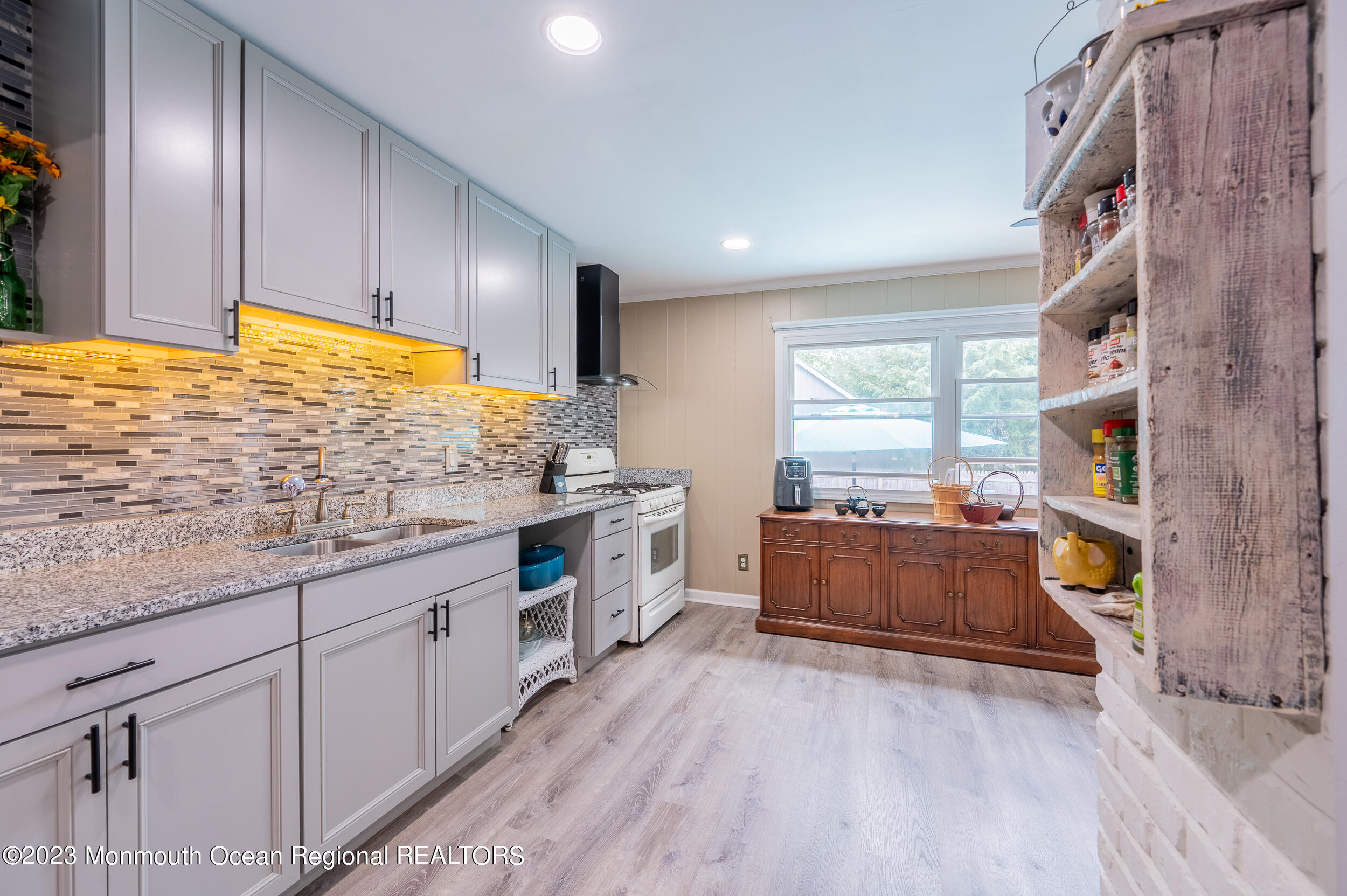 30 London Road Brick, NJ 08723 - Photo 20 of 64 a kitchen with stainless steel appliances granite countertop a stove a sink and a refrigerator