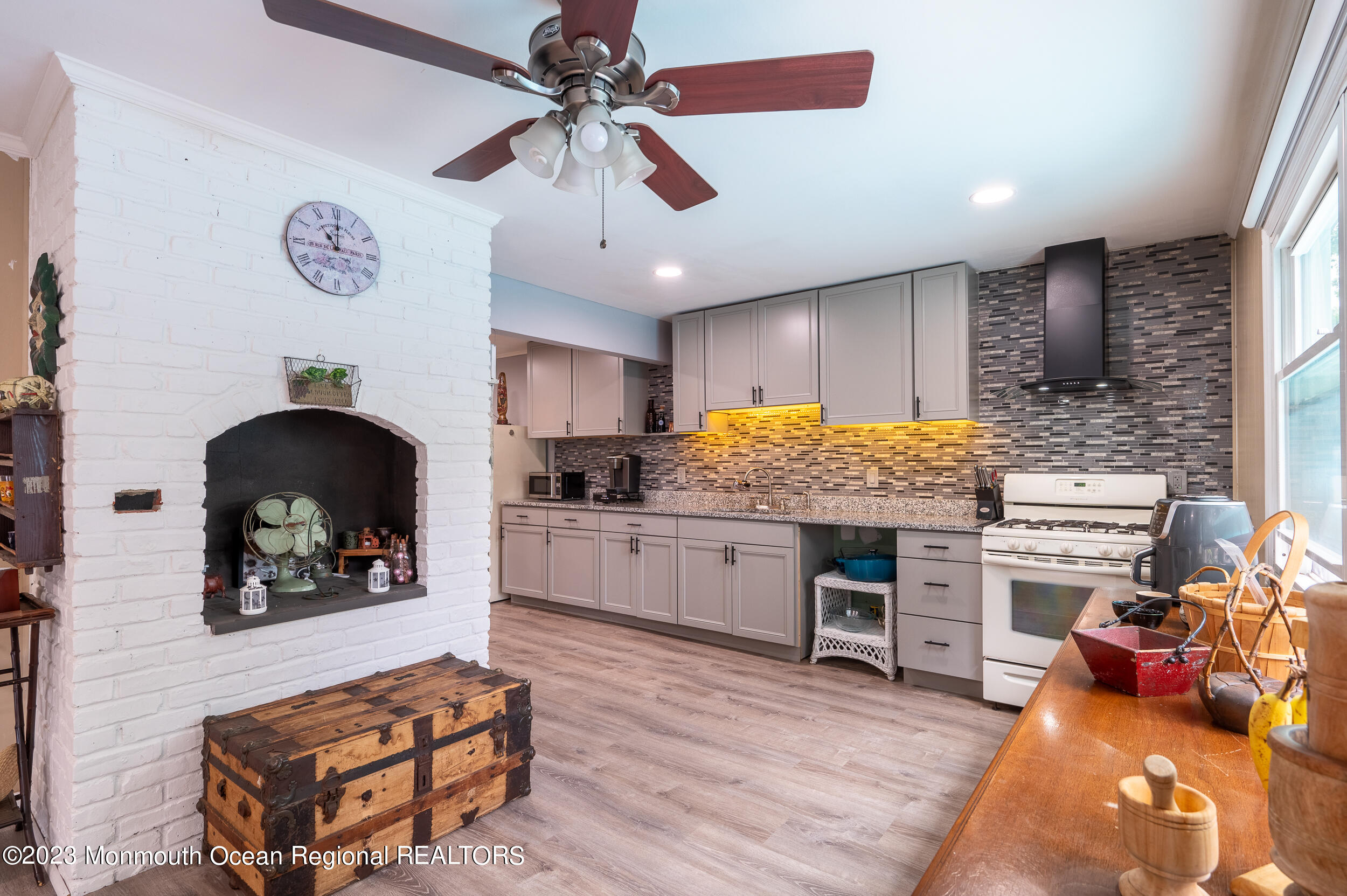 30 London Road Brick, NJ 08723 - Photo 22 of 64 a kitchen with stainless steel appliances kitchen island granite countertop a stove and cabinets