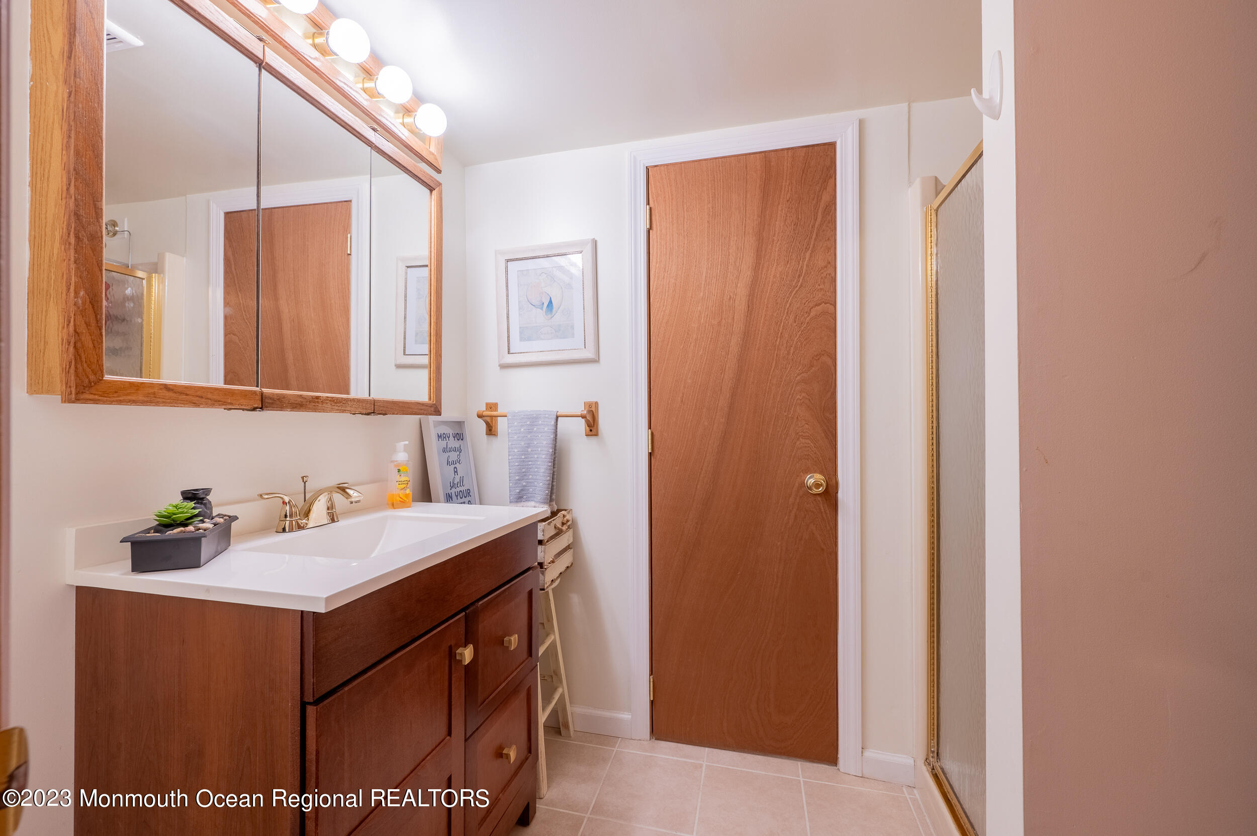 30 London Road Brick, NJ 08723 - Photo 34 of 64 a bathroom with a sink and a mirror