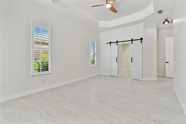 an aerial view of residential houses with outdoor space and swimming pool