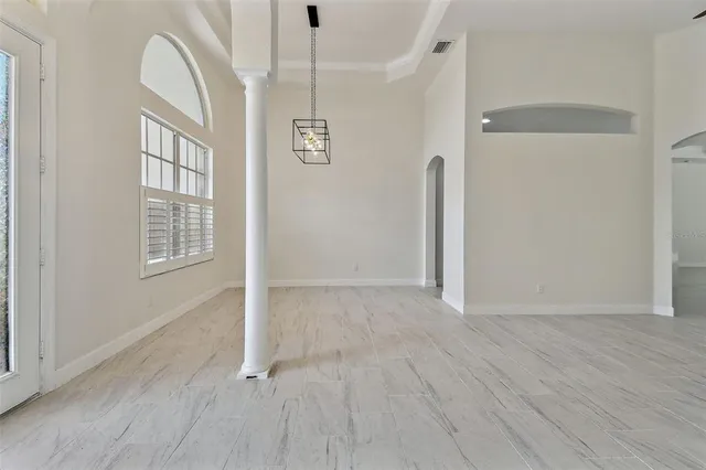 an aerial view of residential houses with outdoor space and trees
