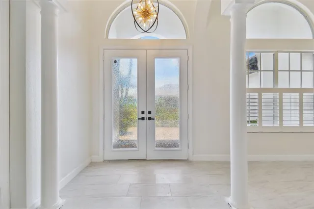 a kitchen with a sink a stove and cabinets