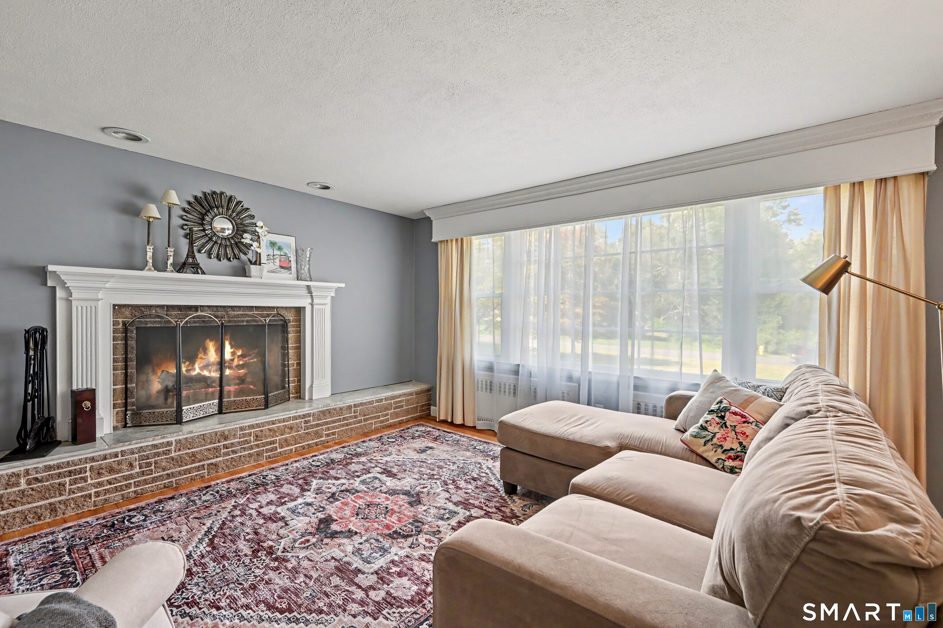 524 Ferry Road Orange, CT 06477 - Photo 6 of 40 a living room with furniture and a fireplace