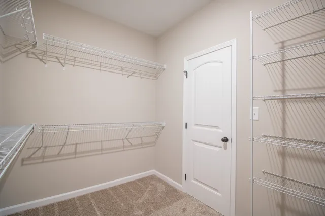 a view of a room with racks on the wall