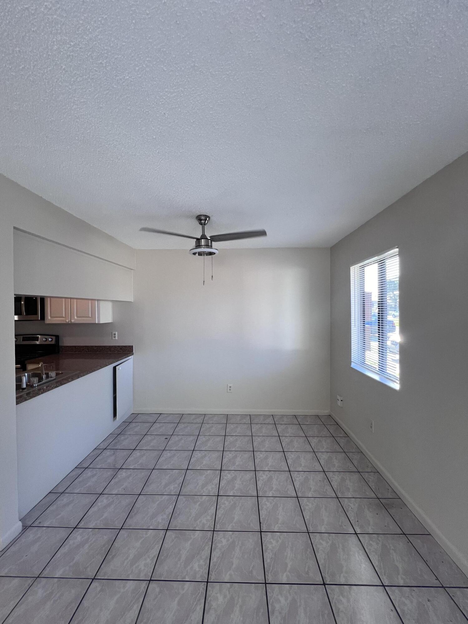 1050 North Fiske Boulevard, Unit 701 Cocoa, FL 32922 - Photo 2 of 5 a view of an empty room and window