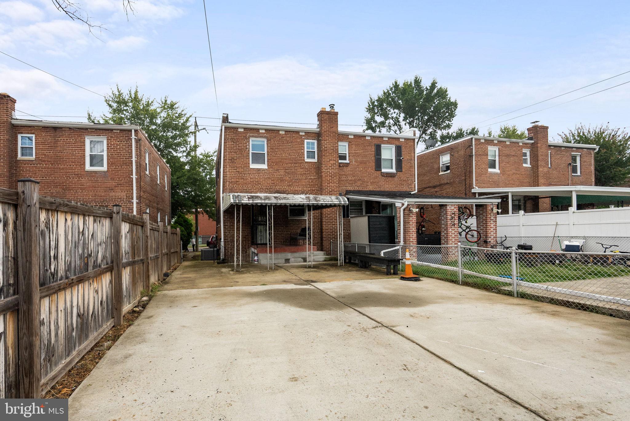 518 Riggs Road Northeast Washington, DC 20011 - Photo 13 of 18 a view of a house with wooden fence