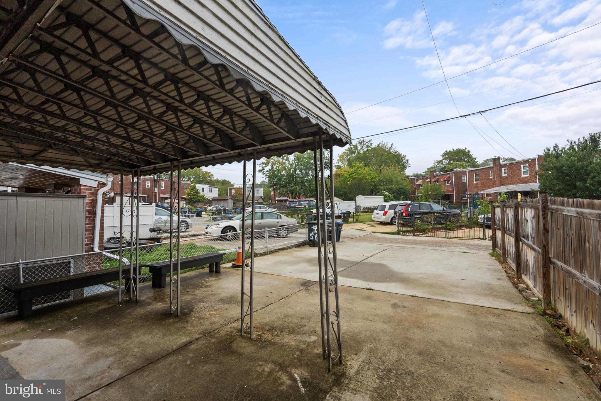 518 Riggs Road Northeast Washington, DC 20011 - Photo 15 of 18 a view of a patio with table and chairs