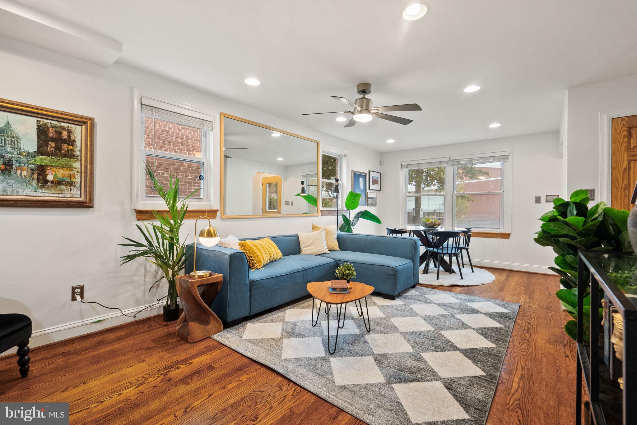 518 Riggs Road Northeast Washington, DC 20011 - Photo 2 of 18 a living room with furniture potted plant and a window