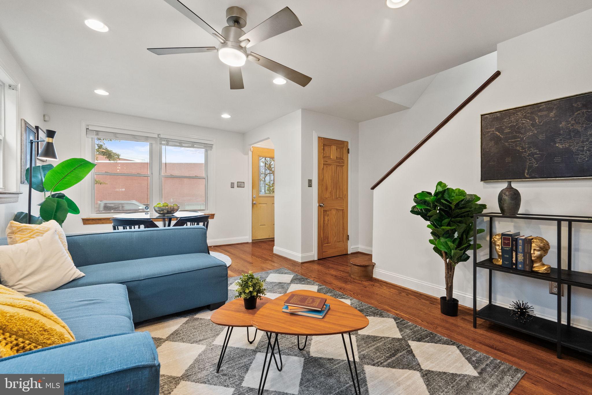 518 Riggs Road Northeast Washington, DC 20011 - Photo 3 of 18 a living room with furniture and a potted plant