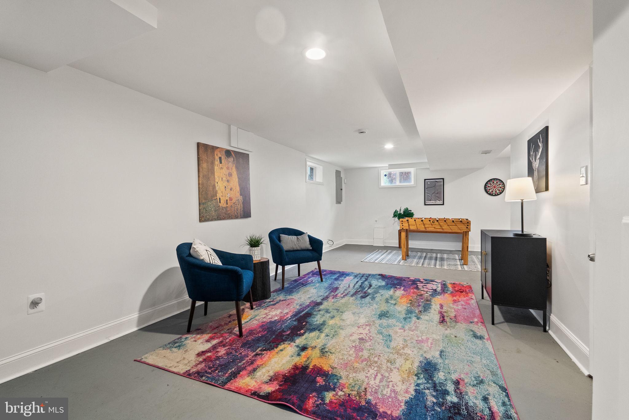 518 Riggs Road Northeast Washington, DC 20011 - Photo 6 of 18 a living room with furniture and a flat screen tv