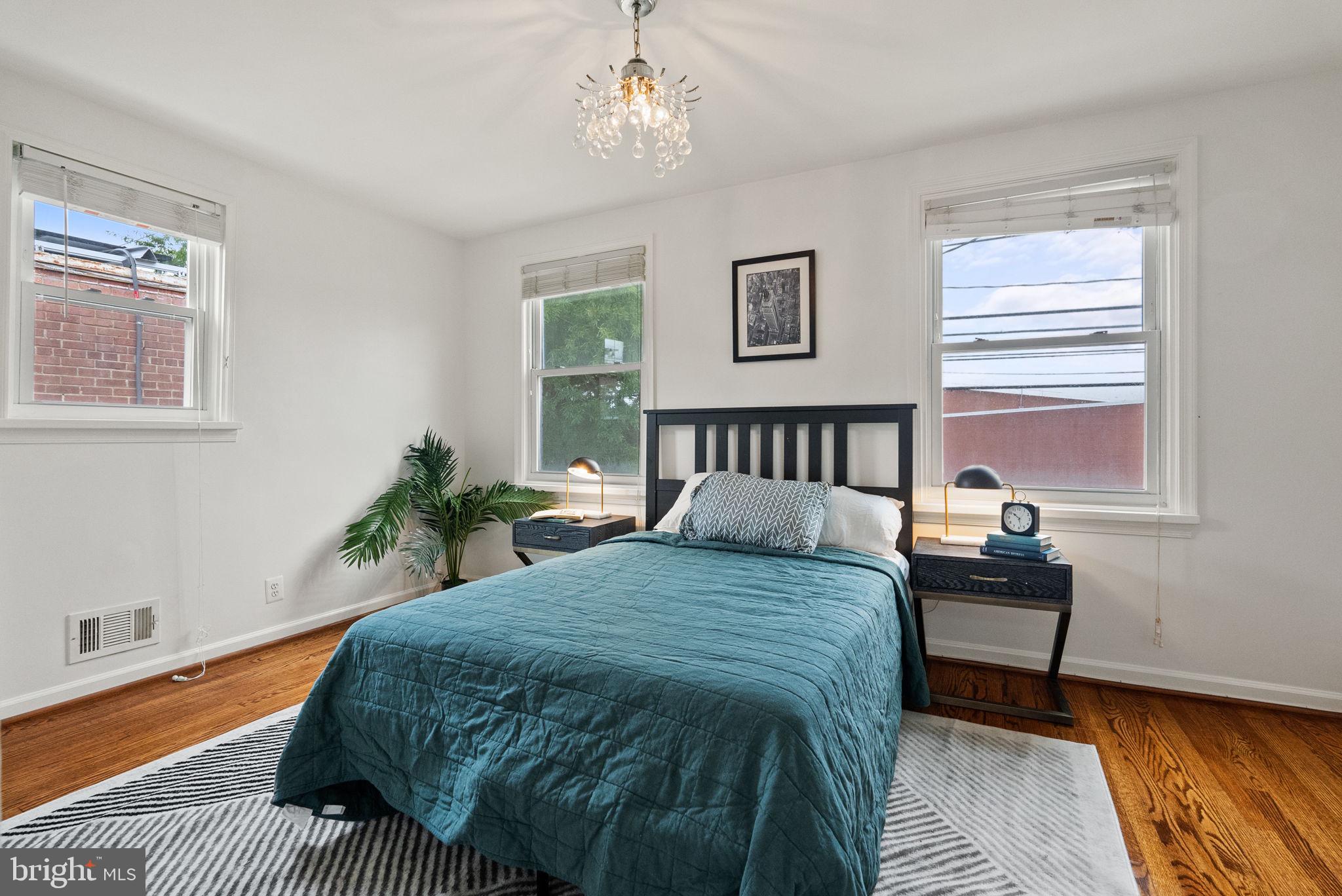518 Riggs Road Northeast Washington, DC 20011 - Photo 8 of 18 a bedroom with a bed and a window