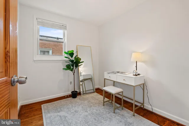 a view of a room with a table and workspace