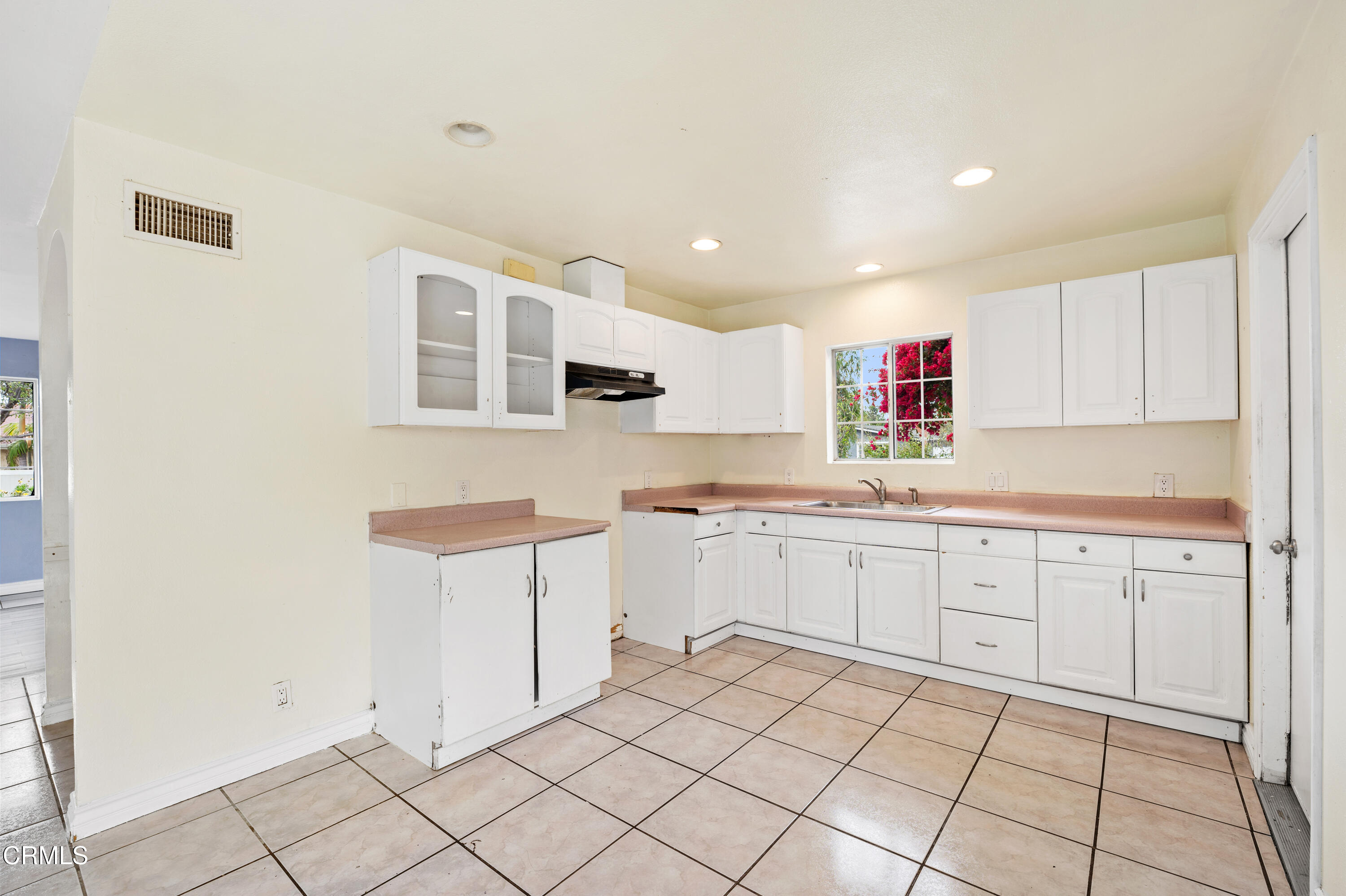 918 Ann Arbor Avenue Ventura, CA 93004 - Photo 14 of 25 a kitchen with cabinets and window