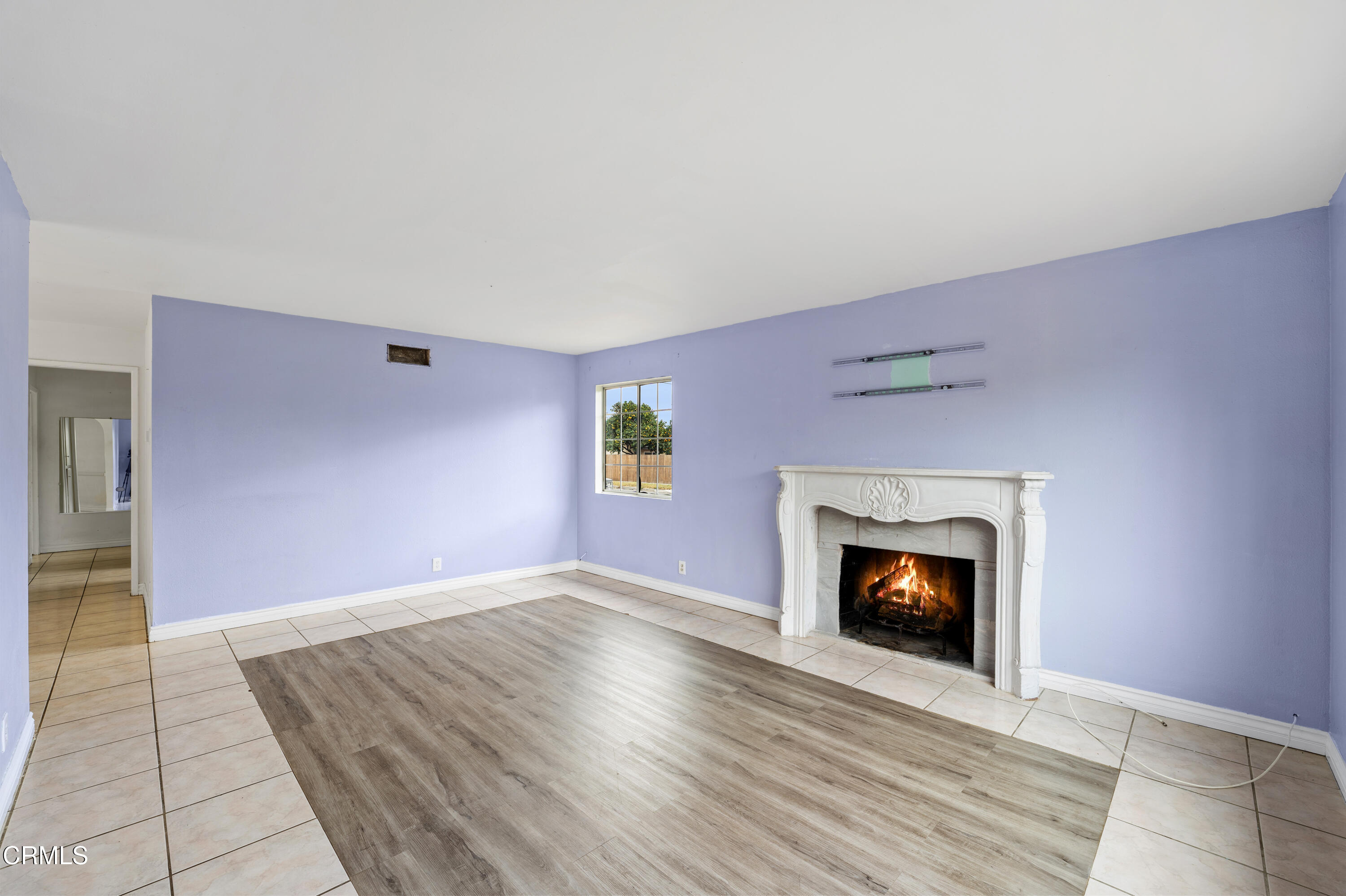 918 Ann Arbor Avenue Ventura, CA 93004 - Photo 8 of 25 a view of an empty room with fire place and a fireplace