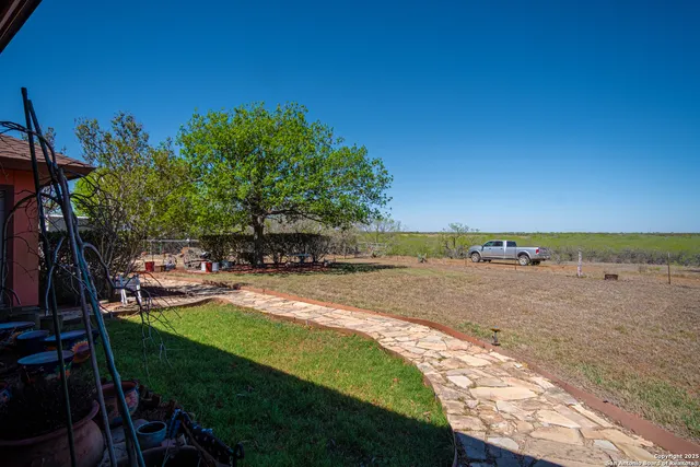 a view of a table and chairs in the patio