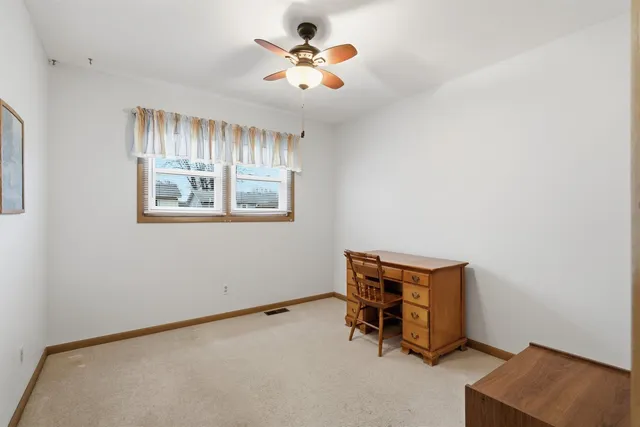 a room with window and a ceiling fan