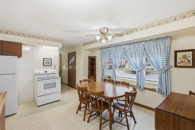 a dining room with furniture and window