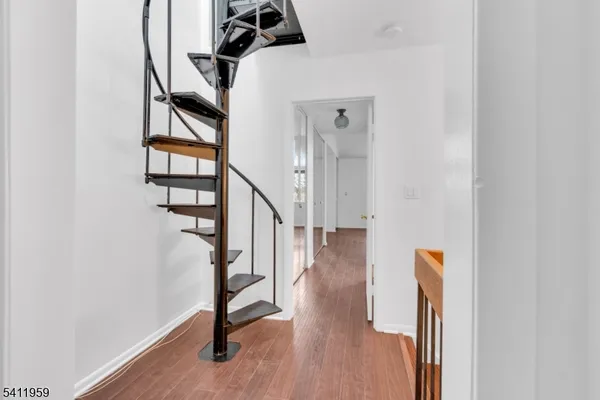 a view of entryway with wooden floor