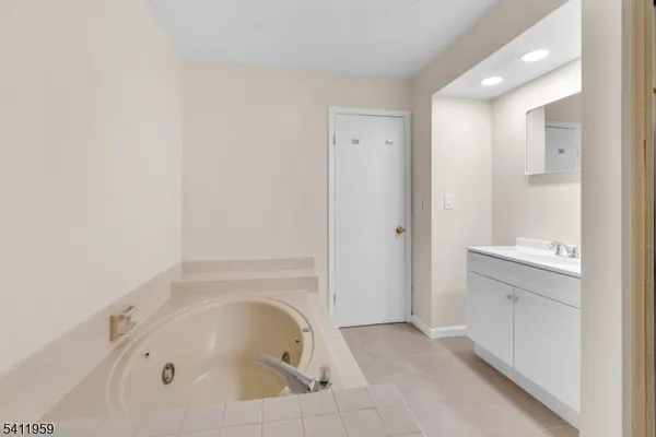 a bathroom with a shower and a sink