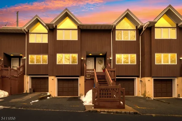 a front view of a house with a garage