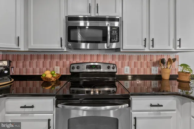 a kitchen with a stove and a microwave
