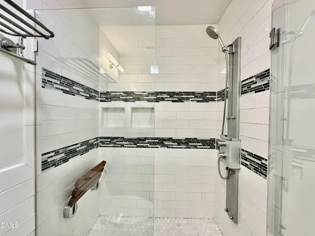 a view of a room with wooden floor and a window