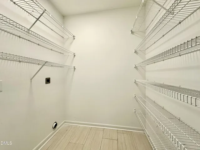 a view of a room with racks on the wall