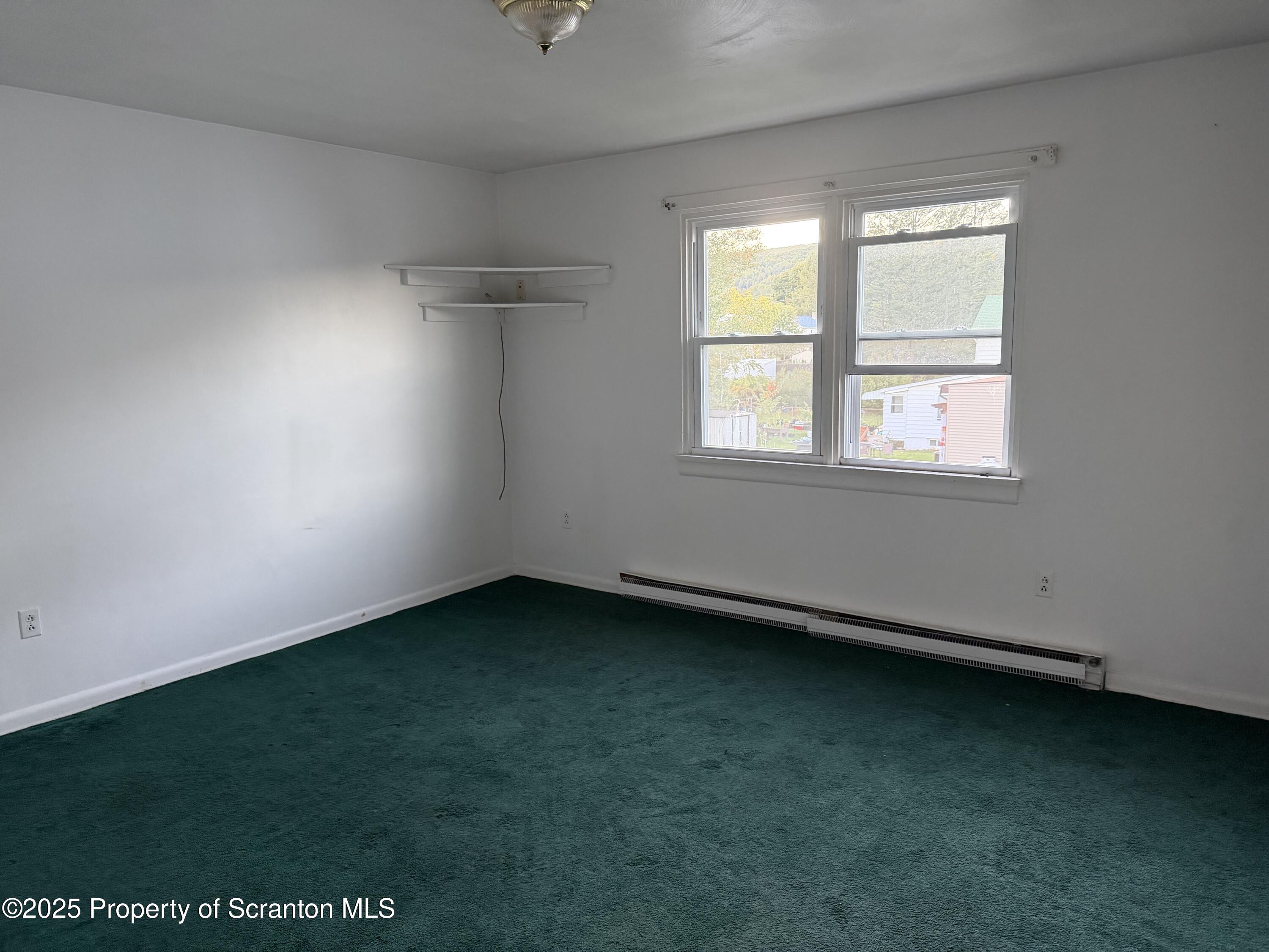 612 Oak Street Old Forge, PA 18518 - Photo 12 of 17 an empty room with a window