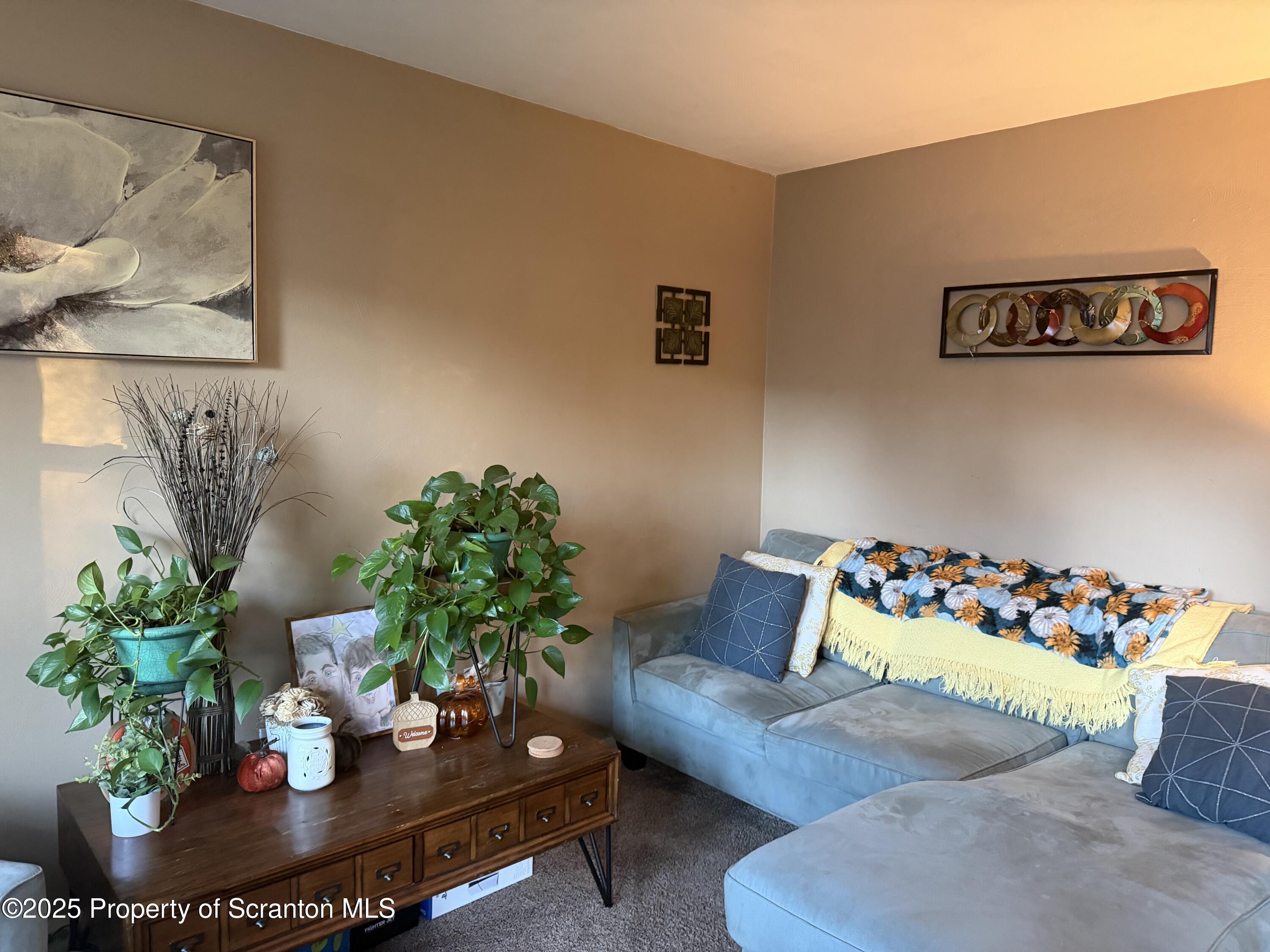 612 Oak Street Old Forge, PA 18518 - Photo 8 of 17 a living room with furniture and flowers