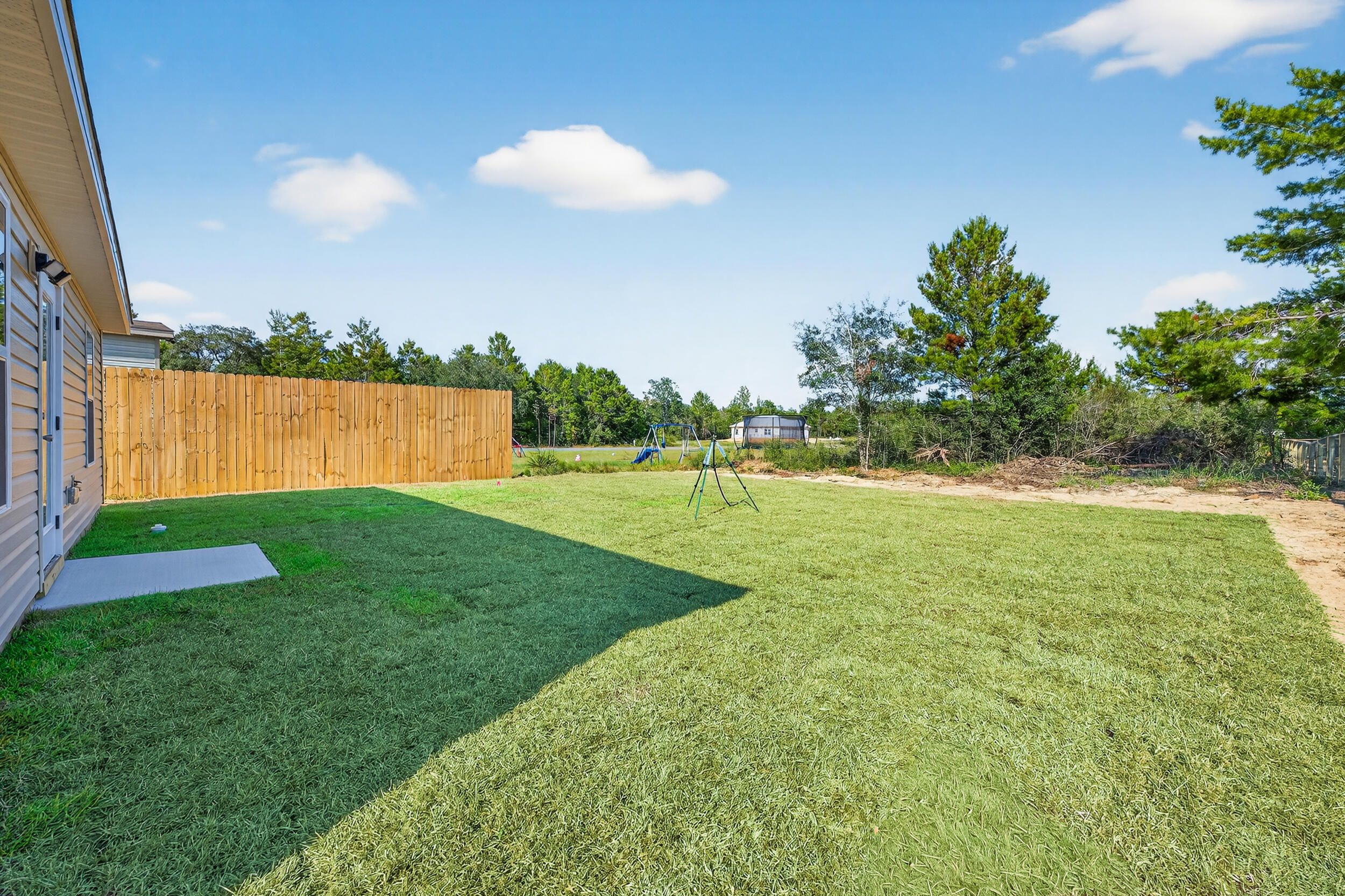 5327 B Kervin Road Crestview, FL 32539 - Photo 44 of 47 a view of a golf course with a lake