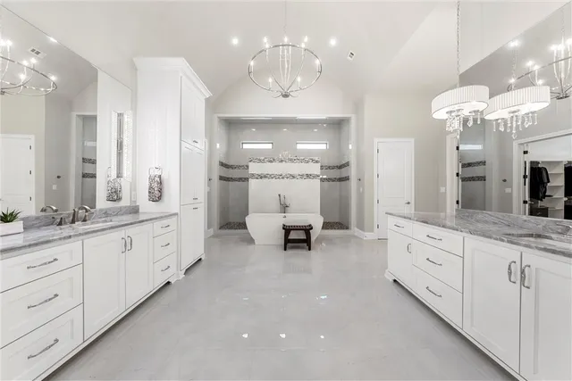 an aerial view of a houses with a yard and lake view