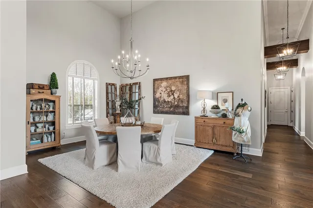 a living room with furniture and large windows