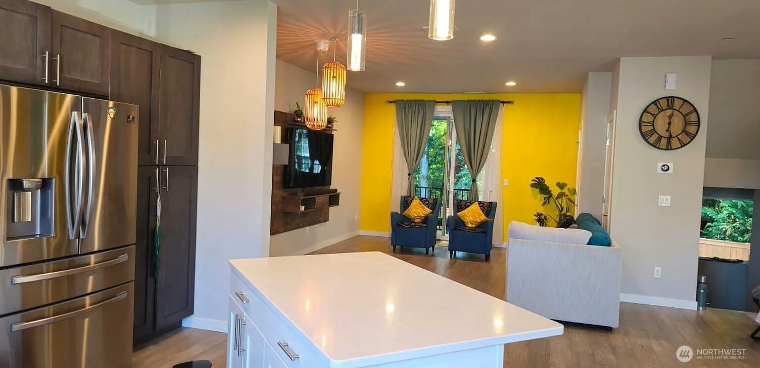 22823 23rd Avenue Southeast, Unit 8 Bothell, WA 98021 - Photo 17 of 17 a kitchen with stainless steel appliances granite countertop a refrigerator a oven and a sink