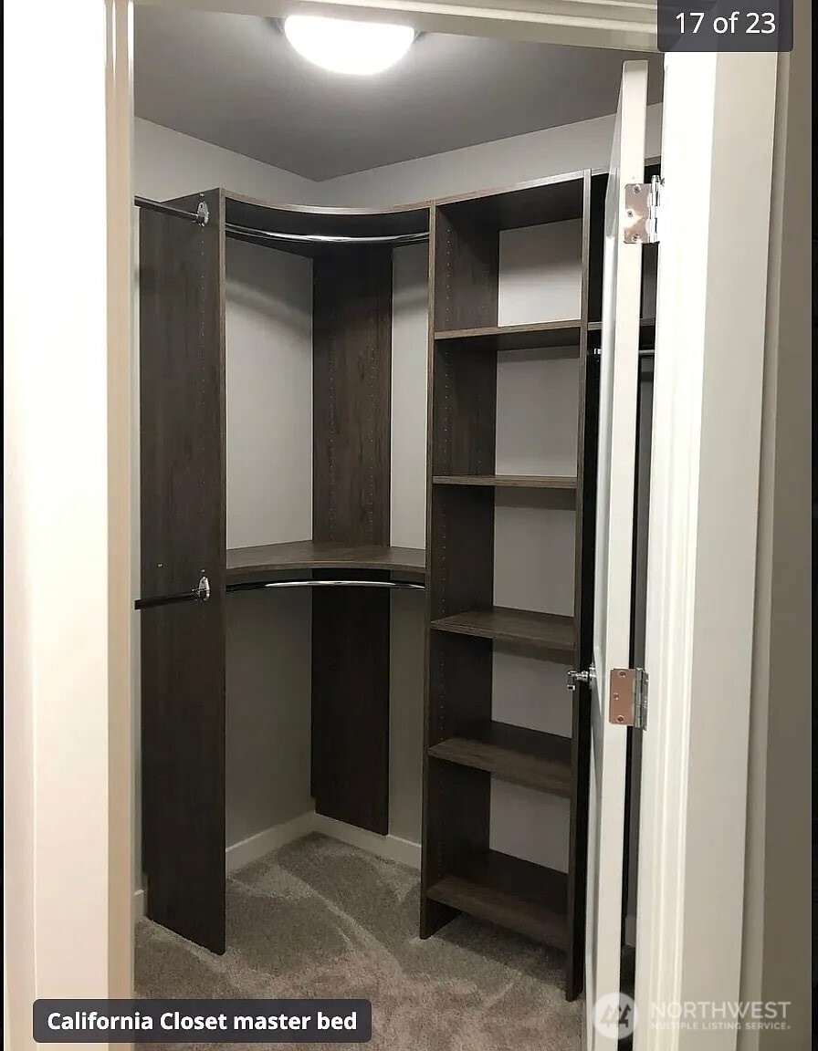 22823 23rd Avenue Southeast, Unit 8 Bothell, WA 98021 - Photo 7 of 17 a view of walk in closet with empty racks