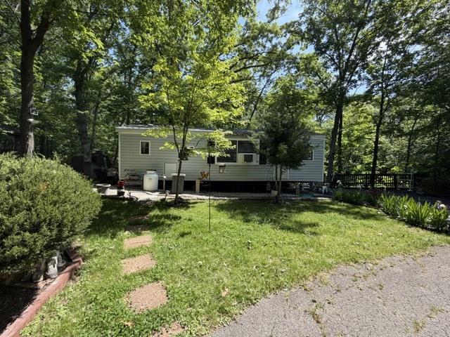 a view of backyard with green space