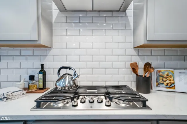 a kitchen with a stove and cabinets